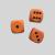 Orange with black dot